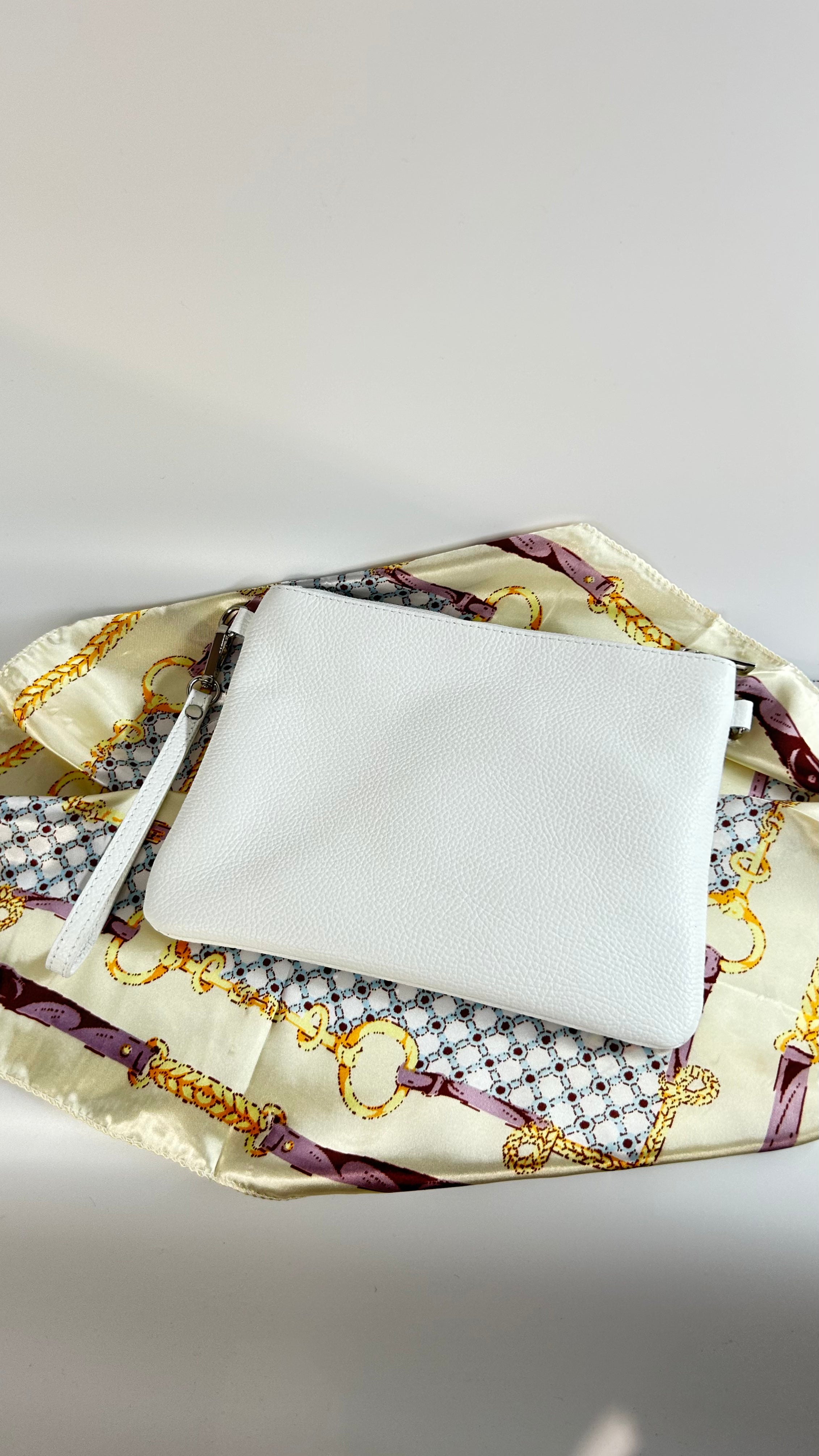 POCHETTE IN VERA PELLE MARTELLATA